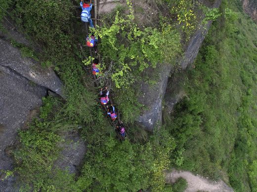 635999473892080701-AP-China-Village-Ladder.2