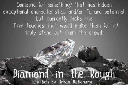 A diamond in a pile of coal shows the evolution of a precious gem.