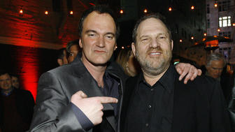 Quentin Tarantino points at Harvey Weinstein at the after-party for the premiere of Grindhouse in Los Angeles